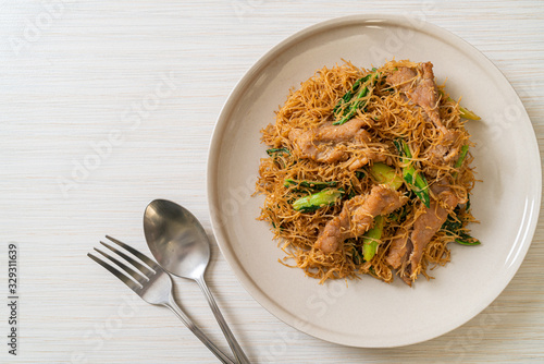 Stir fried rice vermicelli noodle with black soy sauce and pork
