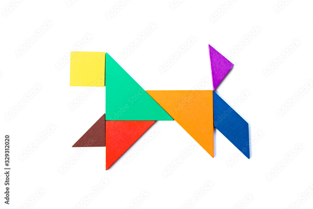 Color wood tangram puzzle in dog shape on white background