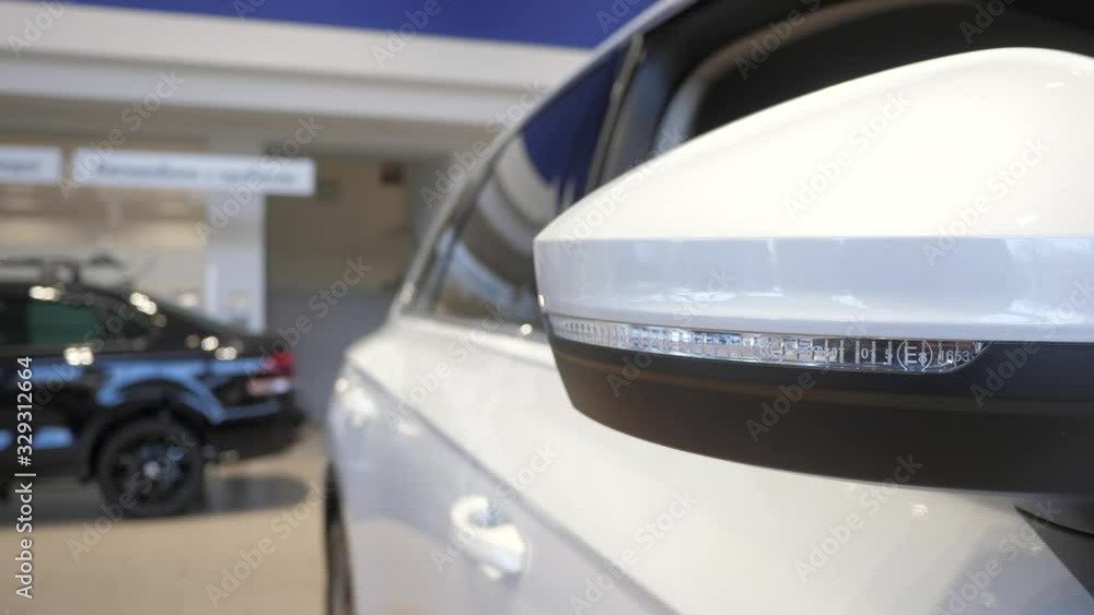 New white car at a car dealership. Elements of the car. Daylight New white car at a car dealership. Elements of the car. Daylight