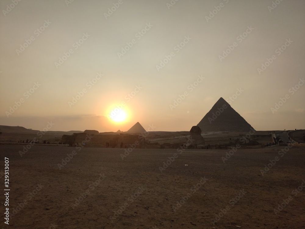 sunset over the pyramids in egypt