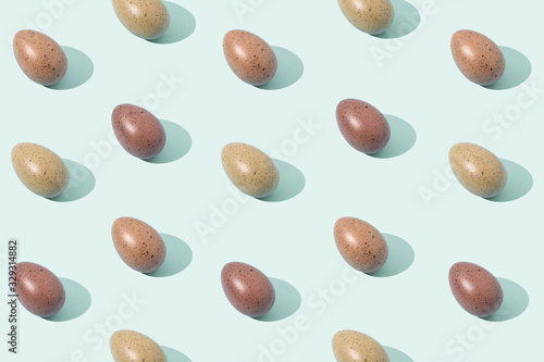 Eggs on green background. Trendy Easter pattern.