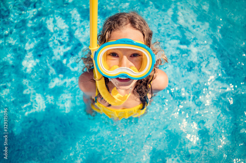 Happy child in swimming pool