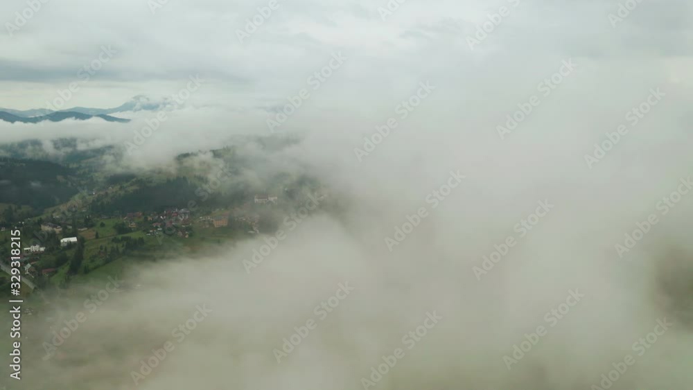 Dramatic weather in the mountains after rain. Fog in the mountains, aerial view. Dramatic weather in the mountains after rain. Fog in the mountains, aerial view.