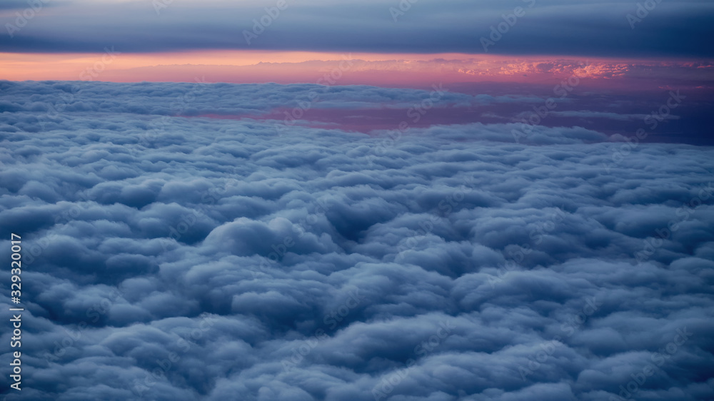 Sea of clouds in the morning surise from an airplane Sea of clouds in the morning surise from an airplane