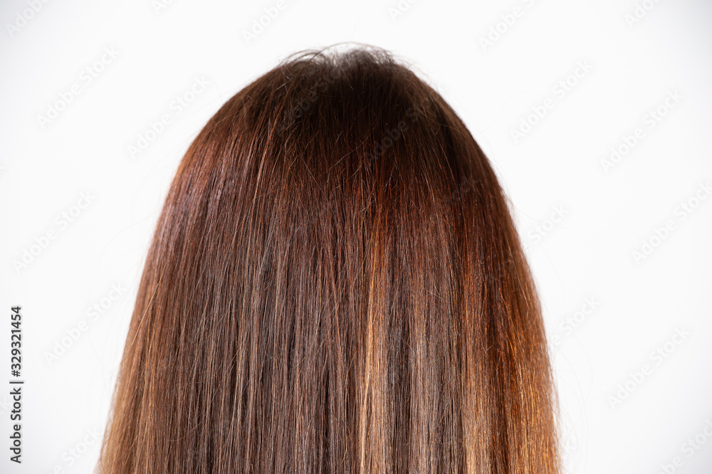 A lady with contemporary long hairs , highlights and streaks in elegant attire A lady with contemporary long hairs , highlights and streaks in elegant attire