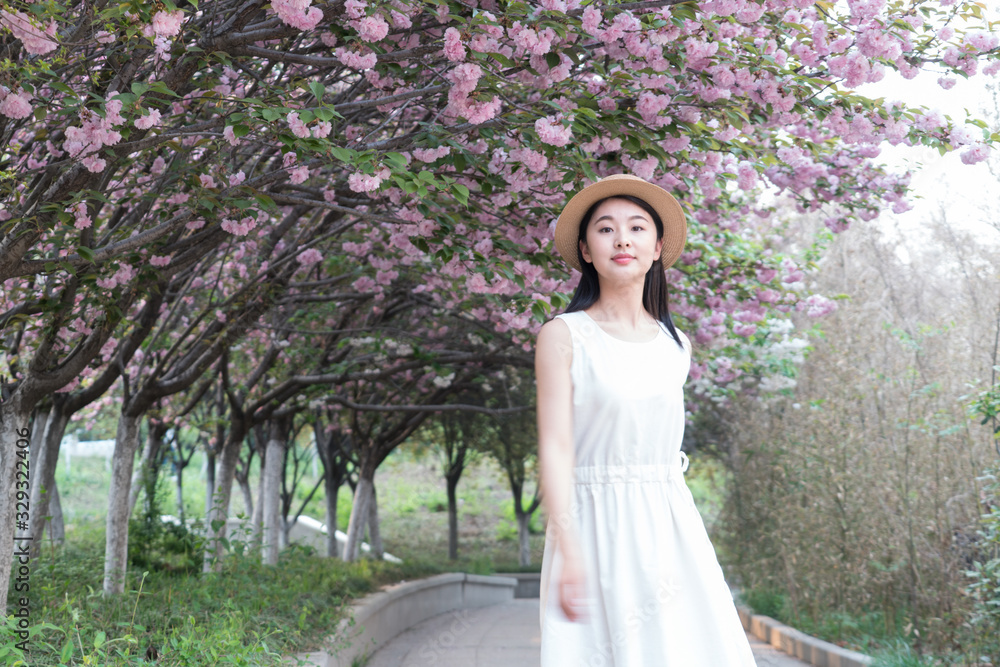 beautiful girl and cherry blossom