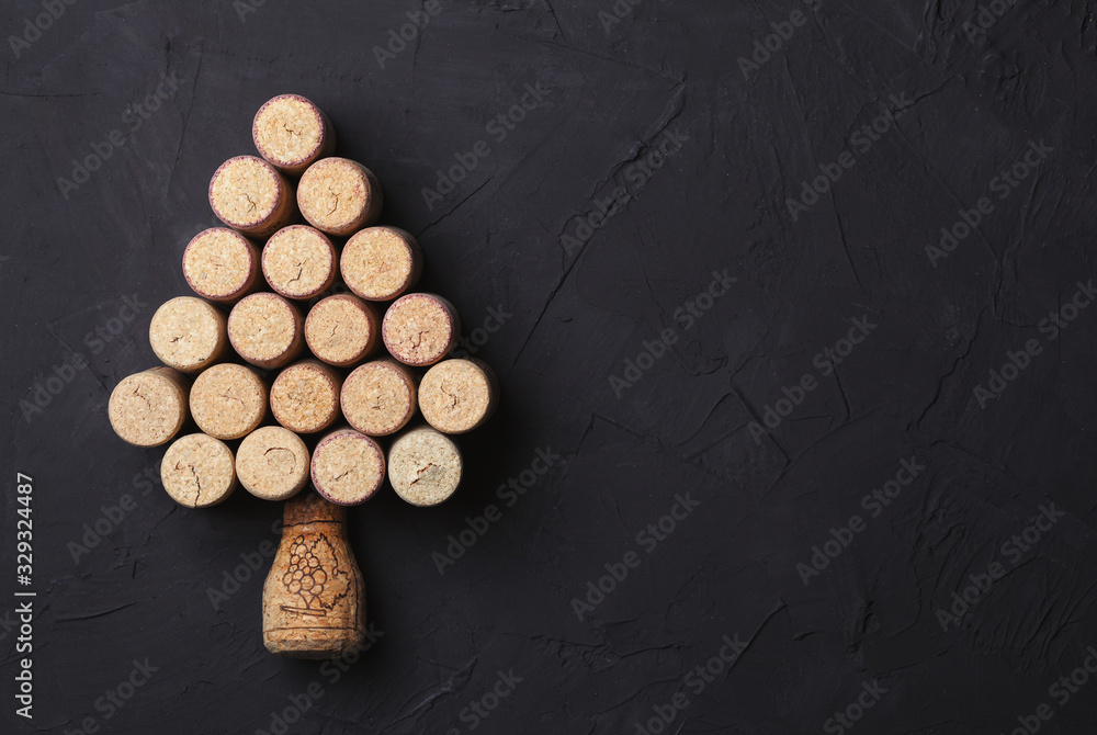 Christmas tree lined with wine corks on a beautiful black background Christmas tree lined with wine corks on a beautiful black background
