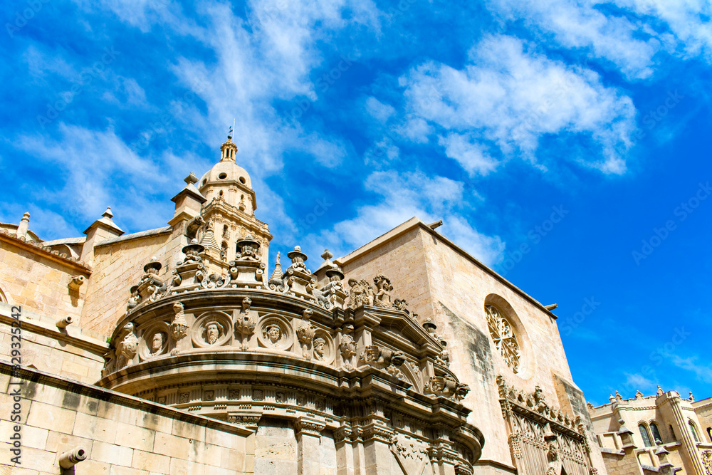 The beautiful cathedral of Saint Mary in the Spanish city of Murcia.   An angular view to the decorative roof top of this medieval building.