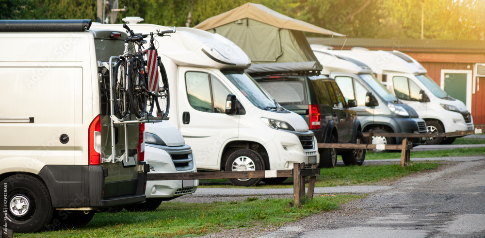 Camper vans in a camping park Camper vans in a camping park