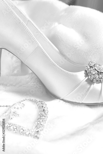 Wedding decor women's shoes and jewelry. Black and white photo in retro style.