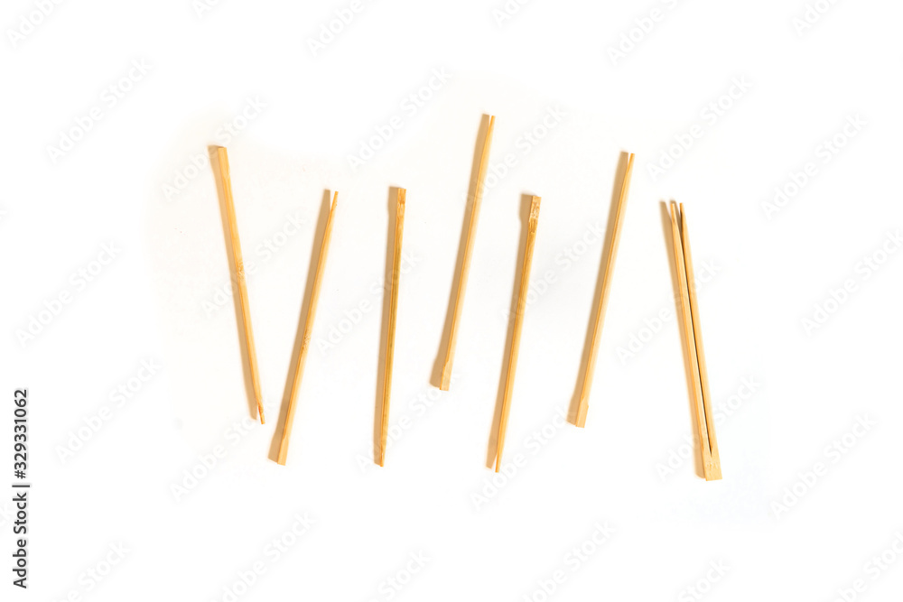 bunch of simple wooden chopsticks flat lay isolated on the table