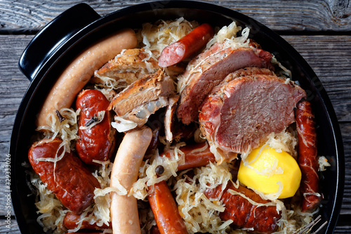 Fototapeta Naklejka Na Ścianę i Meble -  Sour cabbage stew with meat and sausage, close-up