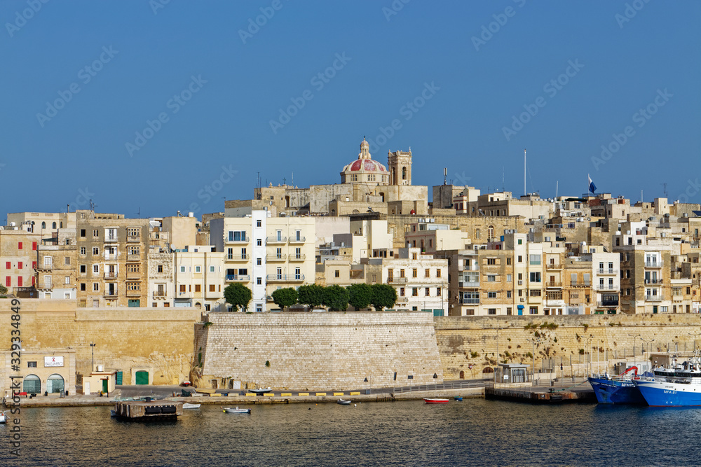Valletta City overlooking the Dock 1 Area of the Grand harbour with its traditional Stone built High Rise Apartments overlooking the Quay.