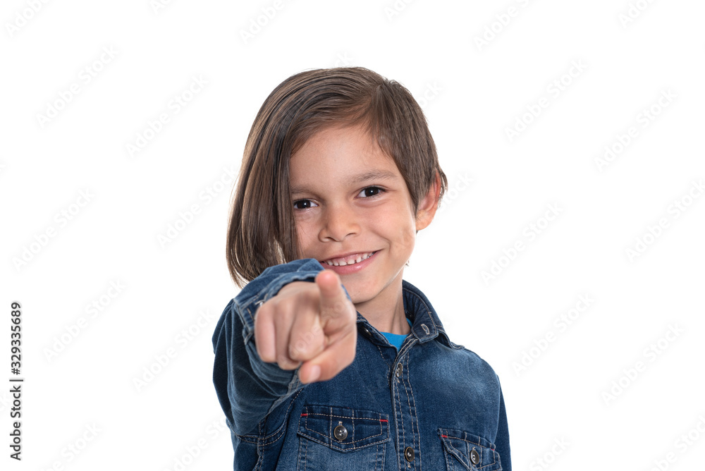 Little boy looking at camera and pointing with hand Little boy looking at camera and pointing with hand
