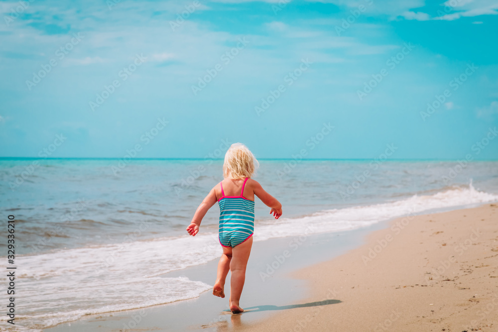 little girl going to swim at beach vacation little girl going to swim at beach vacation