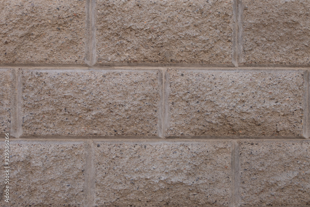 Fototapeta premium Gray brick wall. Torn concrete structure. Creative vintage background.