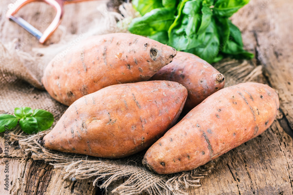 Sweet potato on Wooden background Sweet potato on Wooden background