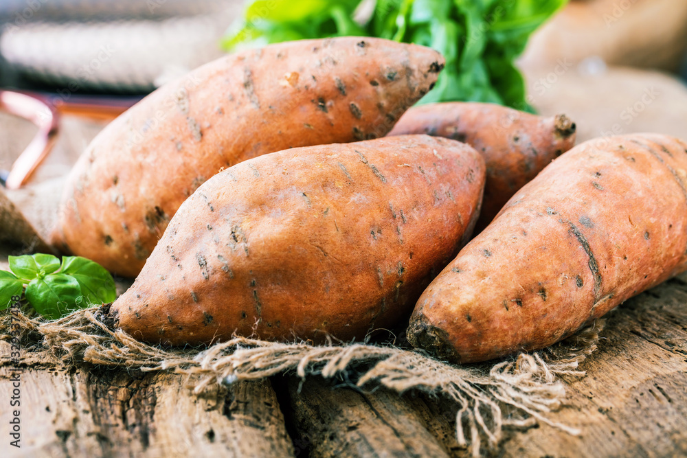 Sweet potato on Wooden background 