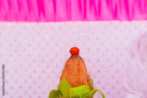 Indian wedding ceremony : decorative coper kalash with green leaf and coconut  photo