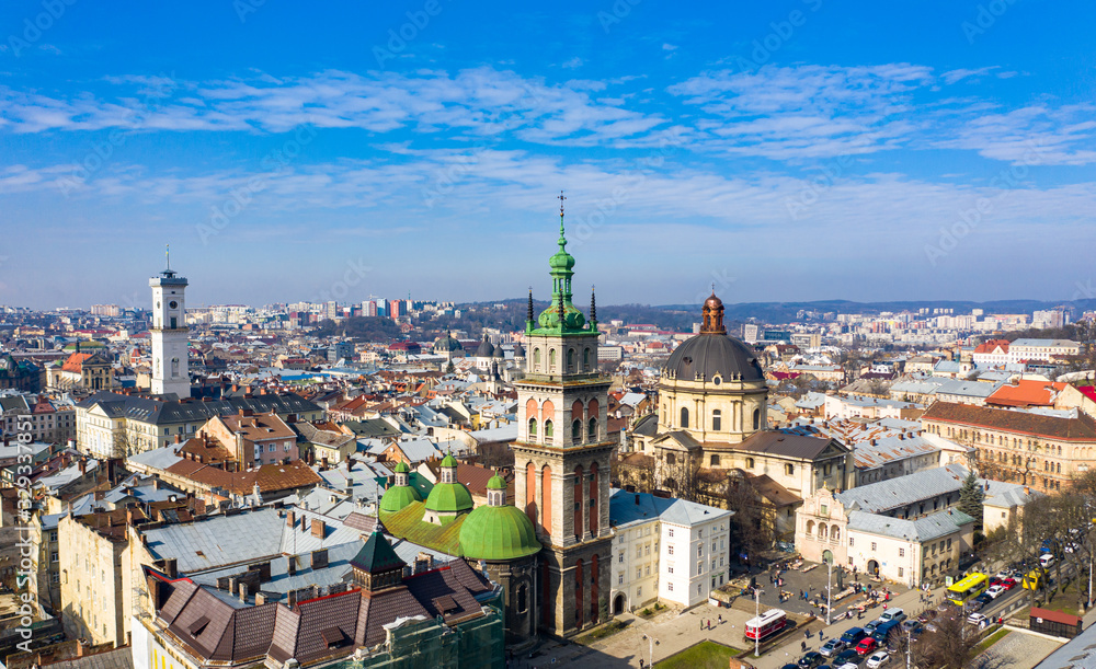 Fototapeta premium Aerial view on Dominican Church and Dormition Church in Lviv, Ukraine from drone