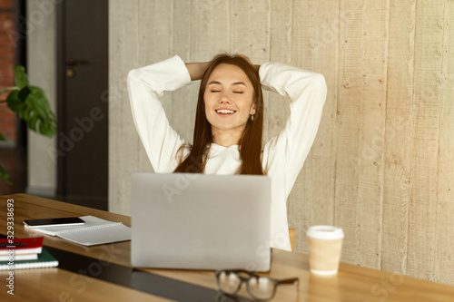 Break during work. Freelance girl closed eyes