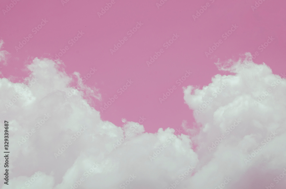 Pink sky with white clouds and blurred pattern background