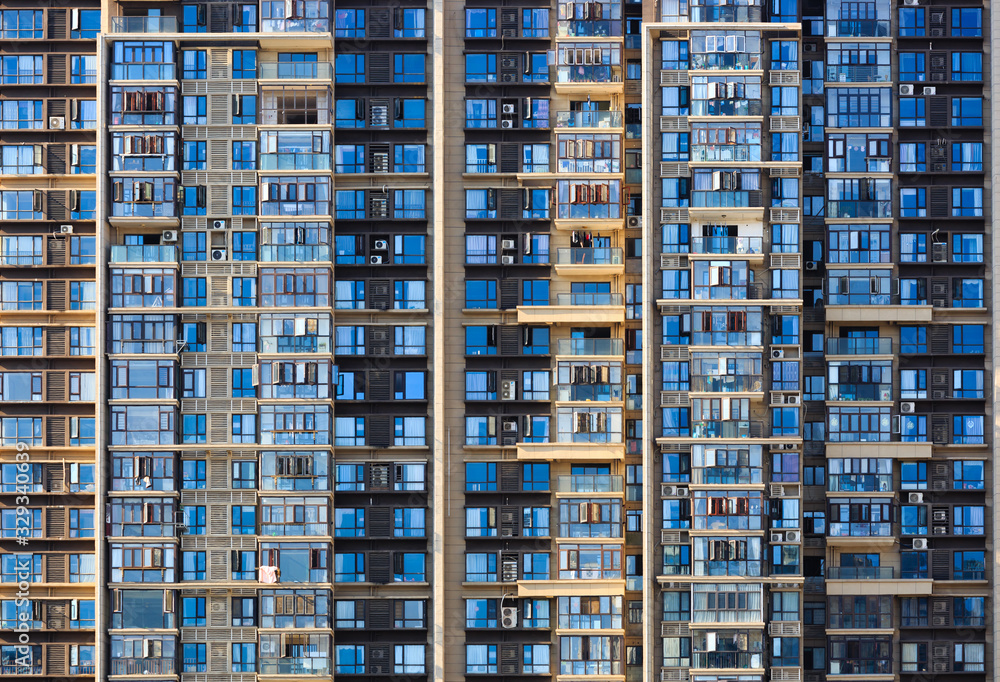 High rise apartment building with modern glass facade Stock Photo ...
