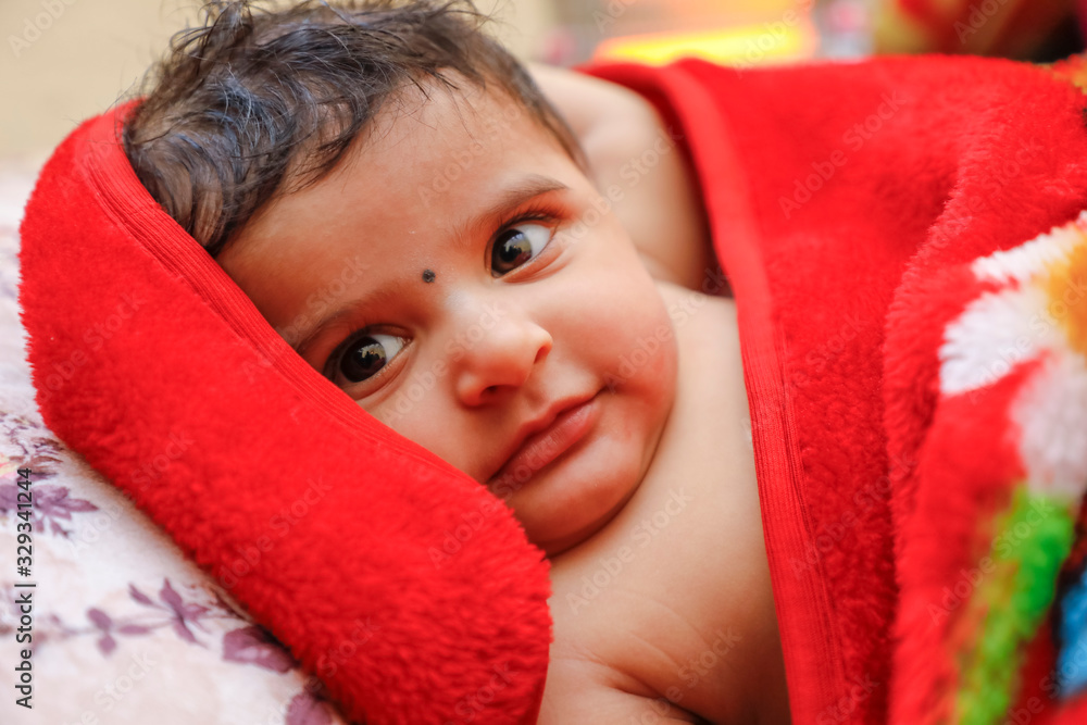 Cute indian little boy playing on bed Cute indian little boy playing on bed