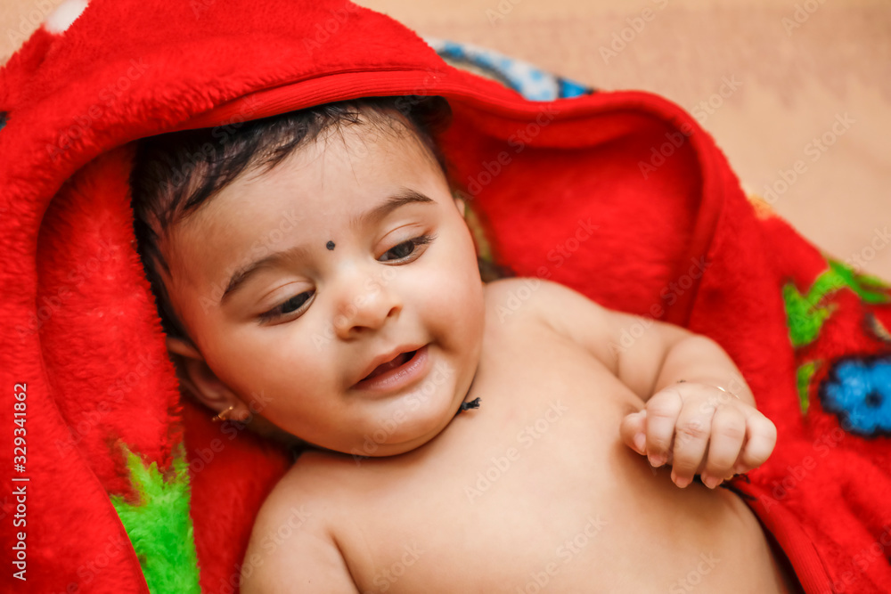 Cute indian little boy playing on bed Cute indian little boy playing on bed