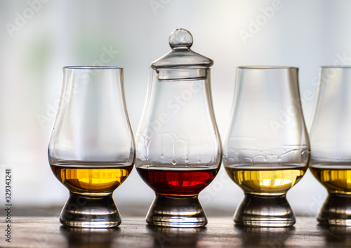 Tasting of flight of Scotch whisky from special tulip-shaped glasses on distillery in Scotland, UK