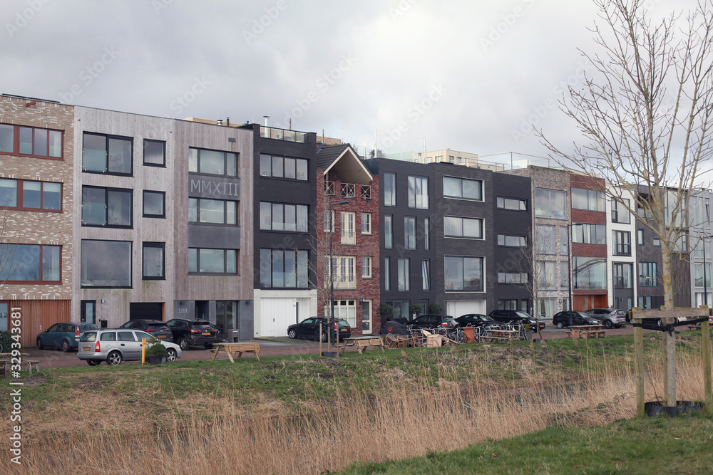 Newly builded residential street with modern design on the Zeeburgereiland, Amsterdam Newly builded residential street with modern design on the Zeeburgereiland, Amsterdam