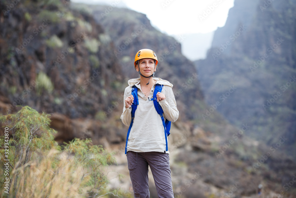 Young woman in the ravine on Tenerife, Spain Young woman in the ravine on Tenerife, Spain
