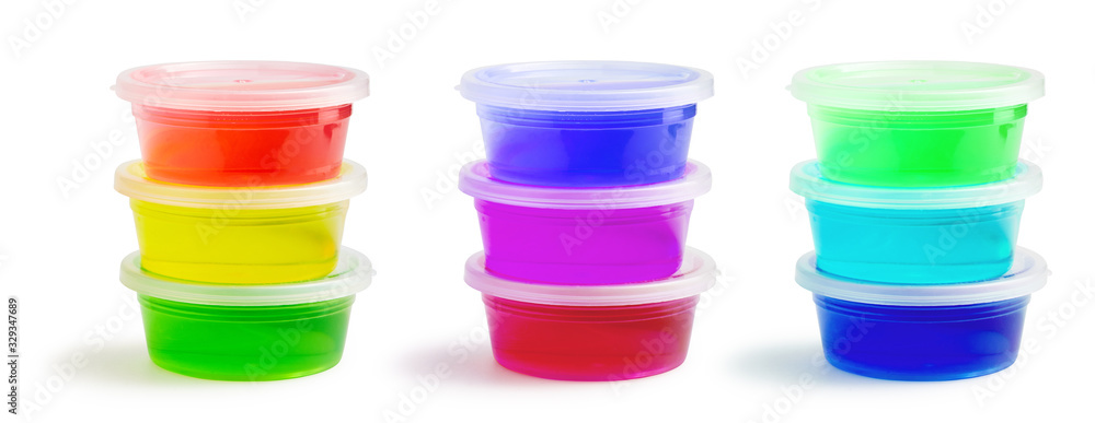 Transparent colorful slimes in plastic boxes isolated on white with clipping path. Set of kids gunk toy, close up view. Transparent colorful slimes in plastic boxes isolated on white with clipping path. Set of kids gunk toy, close up view.