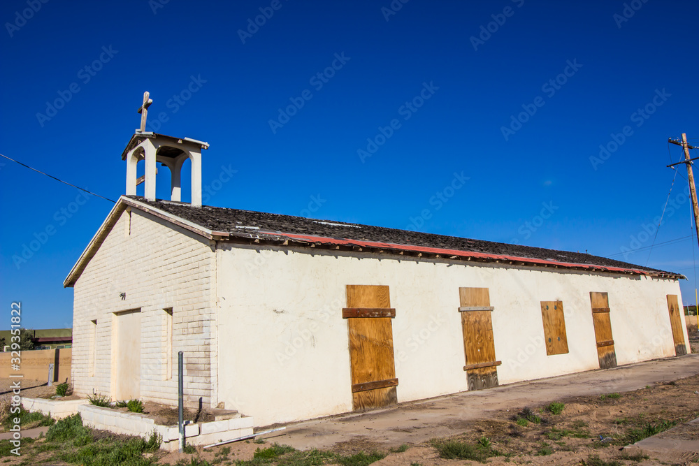 Old Abandoned Church In Disrepair & With Boarded Up Windows