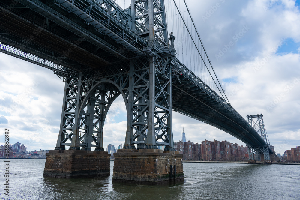 The Williamsburg Bridge over the East River looking towards the Lower East Side of New York City The Williamsburg Bridge over the East River looking towards the Lower East Side of New York City