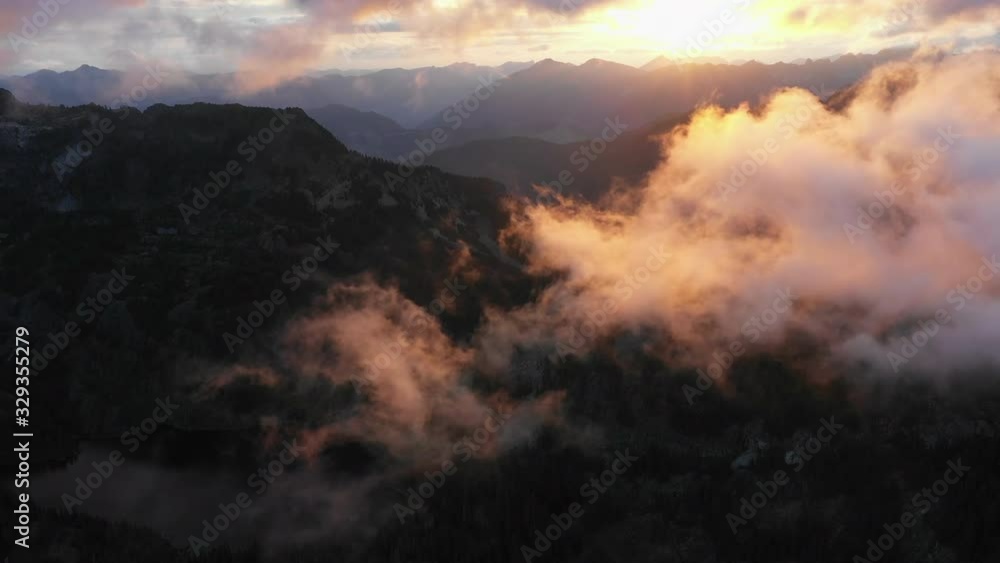 Aerial view of an alpine lake during sunset in the cascade mountains. Filmed in 4K 30fps Aerial view of an alpine lake during sunset in the cascade mountains. Filmed in 4K 30fps