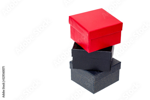 Gray box with black top and red box on top on a white background
