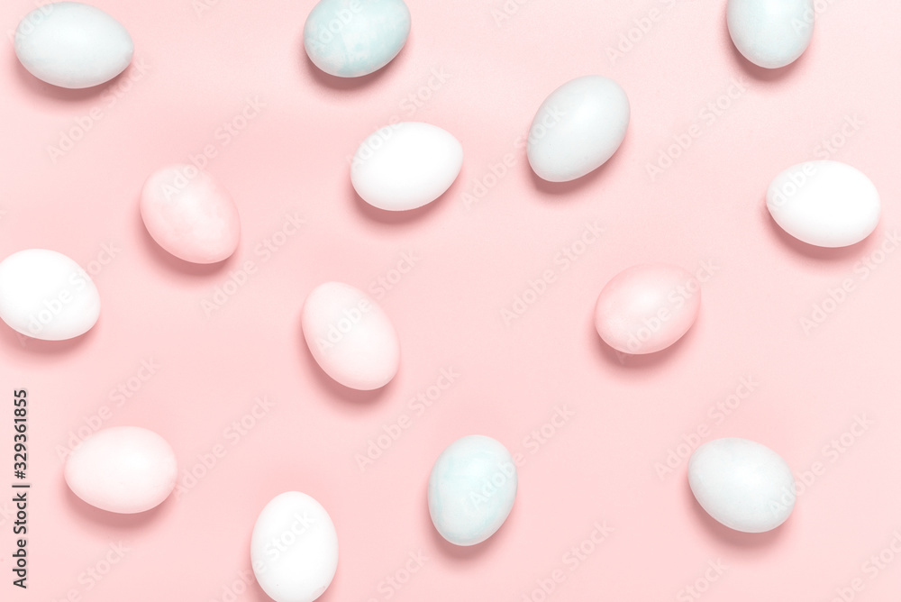 Easter pink and white eggs on a pink background, top view, flat lay, minimal style. Easter background.