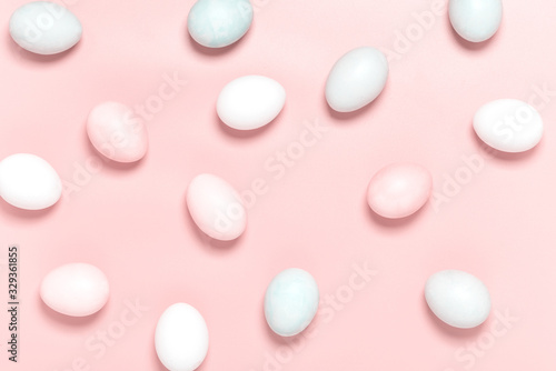 Easter pink and white eggs on a pink background, top view, flat lay, minimal style. Easter background.
