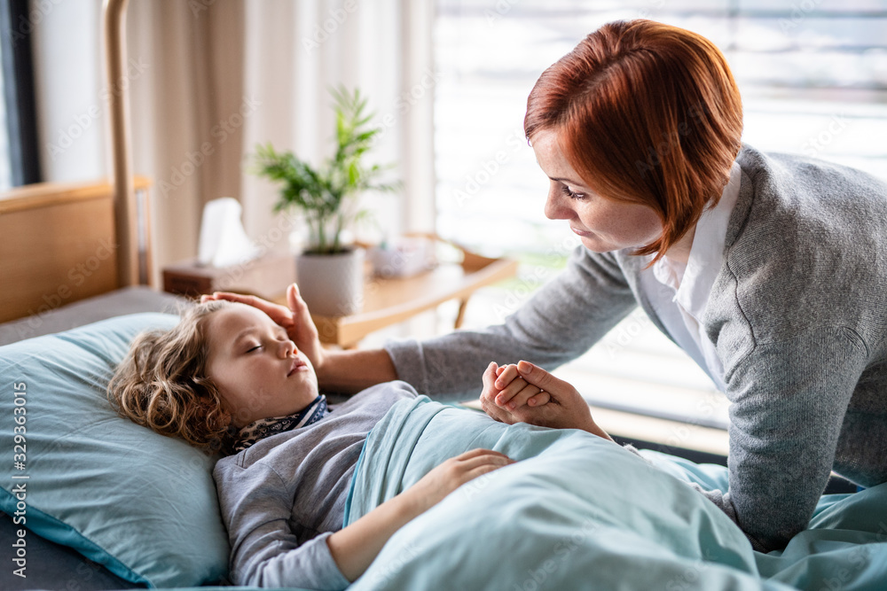 Caring mother visiting small girl daughter in bed in hospital. Caring mother visiting small girl daughter in bed in hospital.