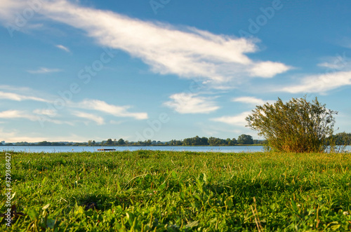 View to the Gartower Lake in Lower Saxony, Germany, under a blue sky. photo