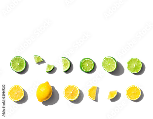 Fresh lemons and limes overhead view - flat lay photo