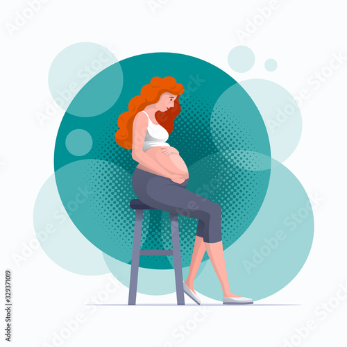 Young pregnant woman holds her hands on her belly.