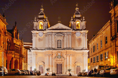 Illuminated Metropolitan Cathedral of Saint Paul, commonly known as St Paul's Cathedral or the Mdina Cathedral. Night view on Roman Catholic cathedral in Mdina, Malta.
