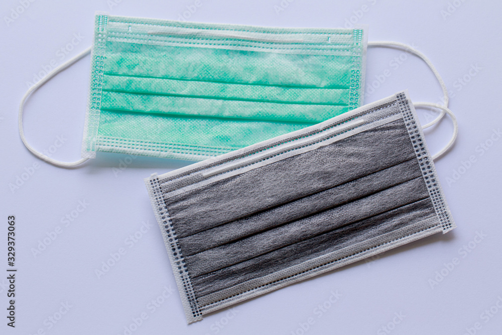 Surgical masks for protective dirt, dust on white background. Top view, close up. Surgical masks for protective dirt, dust on white background. Top view, close up.