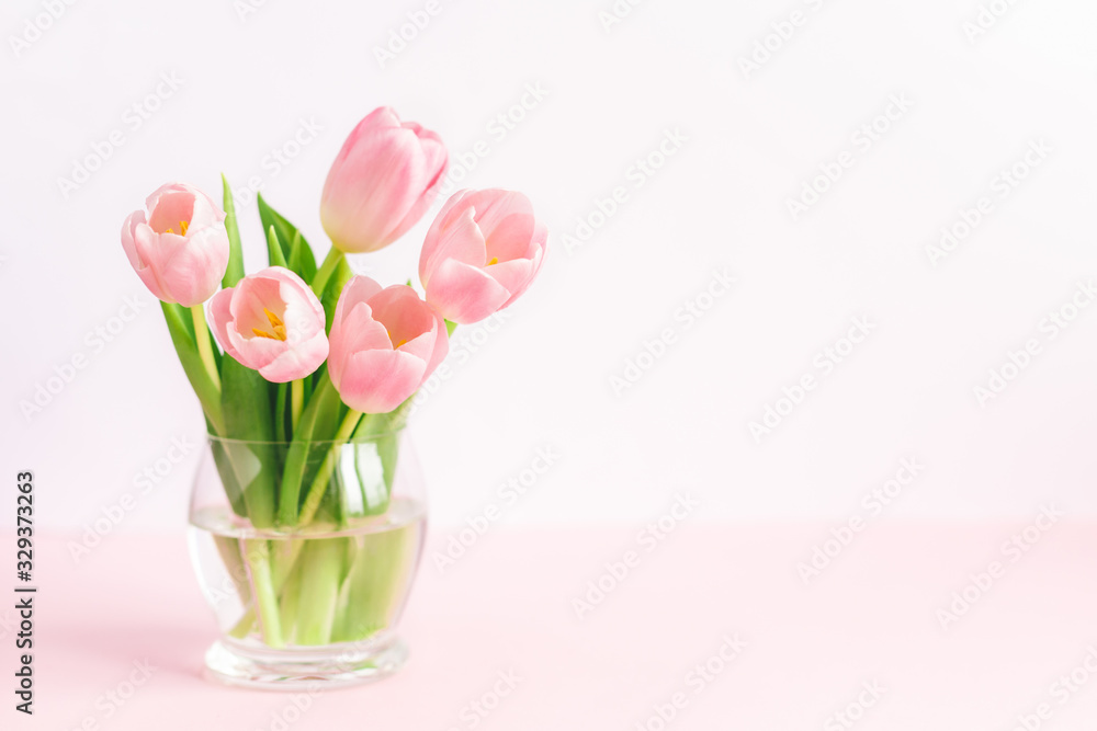 Tender pink tulips in a vase. Greeting card for Mother's day.