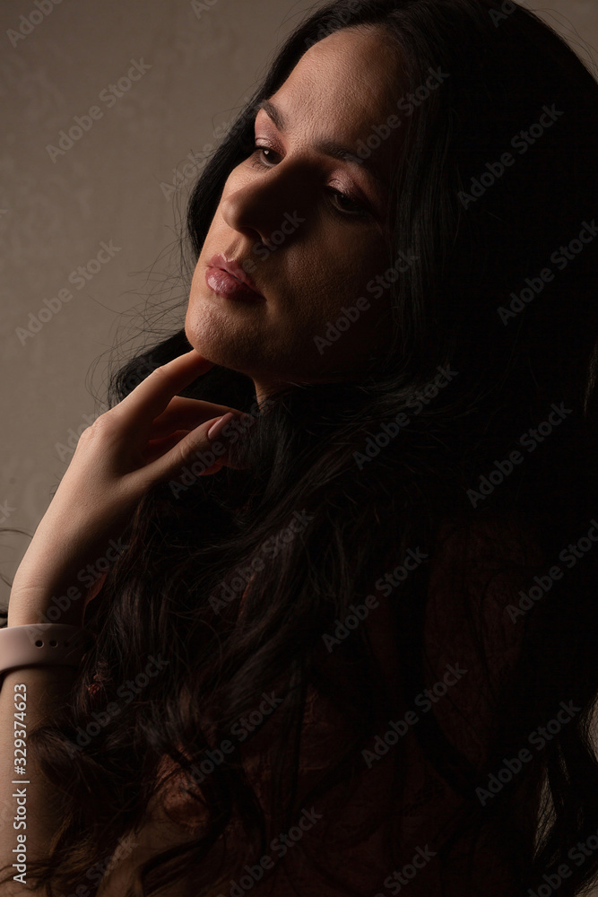 Lovely model posing in the dark room Lovely model posing in the dark room