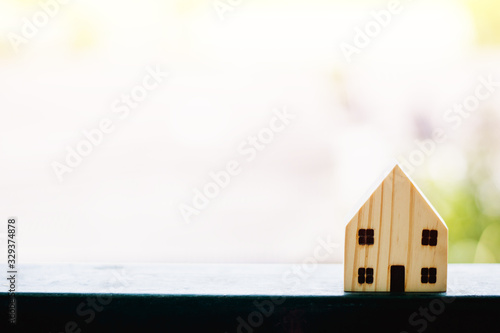Wooden house model against ...