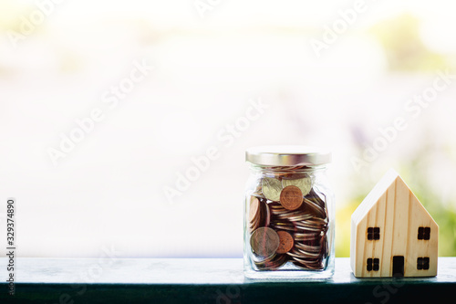 Wooden house model with mon...