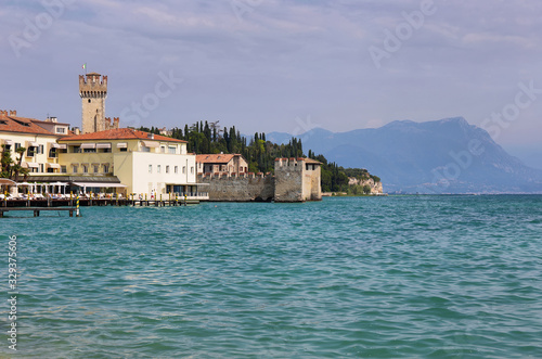 Fototapeta Naklejka Na Ścianę i Meble -  Beautiful peaceful lake Garda with Rocca Scaligera castle in Sirmione, Italy.